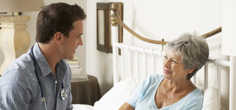 doctor with patient on home visit